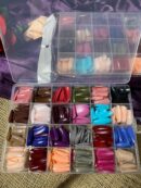 657 multi colored nails in box